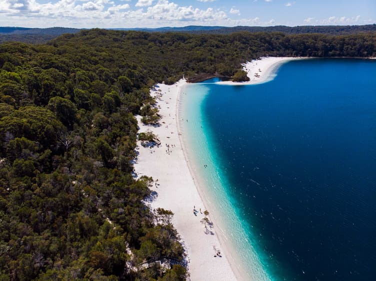 Beautiful blue water along a white sandy beach