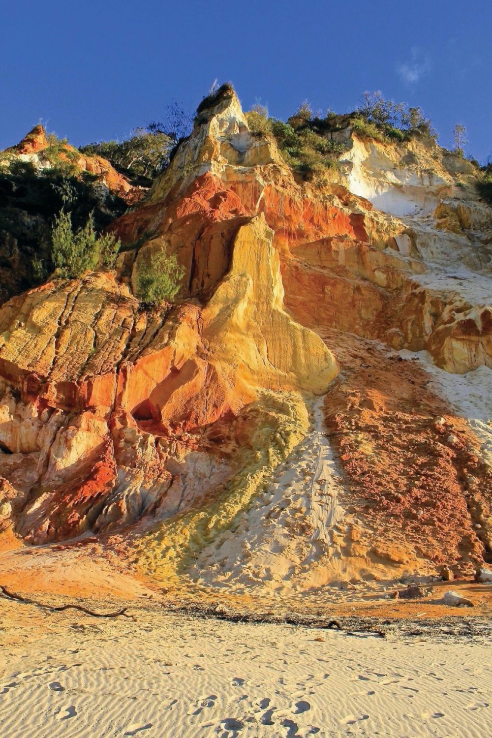 A rocky cliffside with colourful rocks
