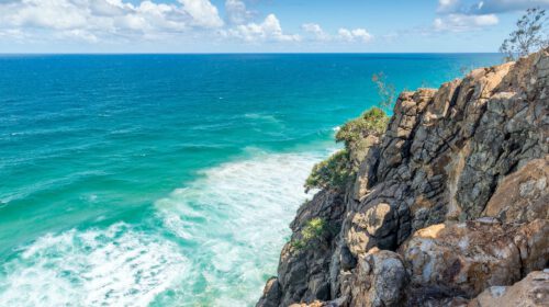 A cliffside with the ocean at the bottom