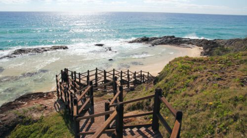 A walkway leading down towards a beach