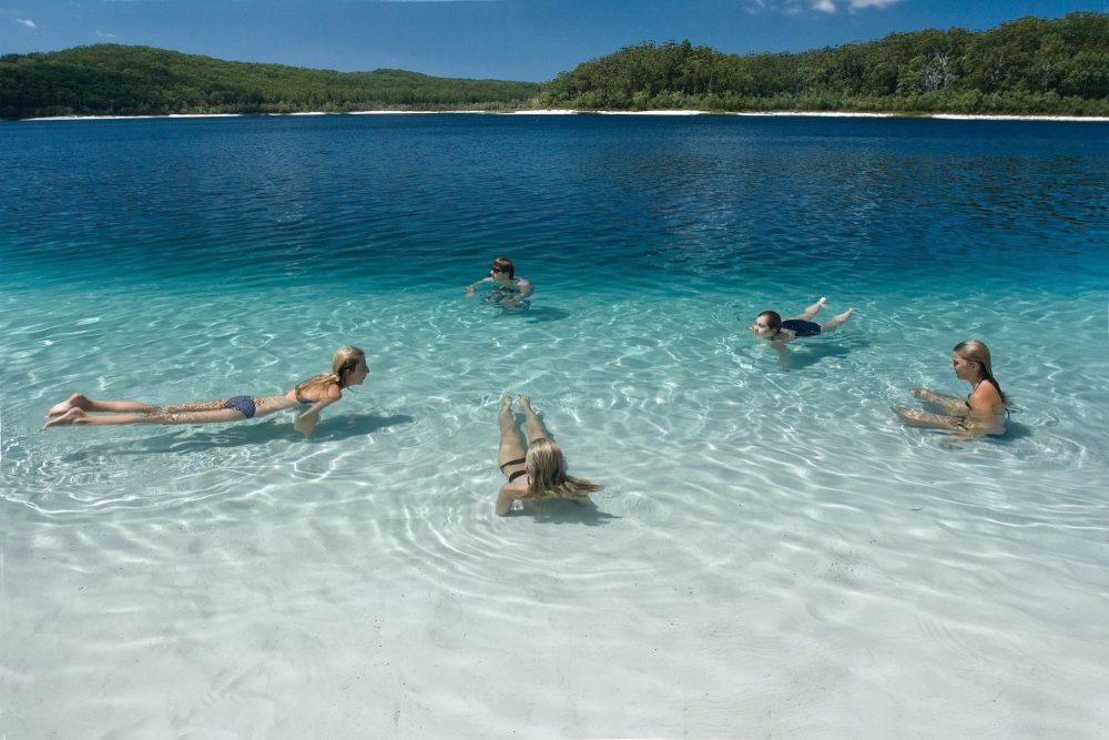 Swimmers floating in Lake McKenzie